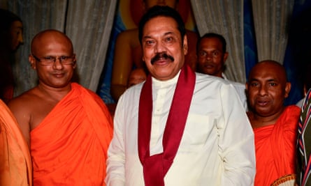 Mahinda Rajapaksa receives blessings from Buddhist monks after being named Sri Lanka’s new prime minister.