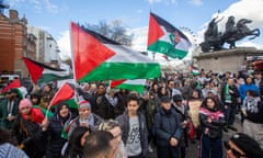 Pro-Palestine protesters with flags in Westminster, London