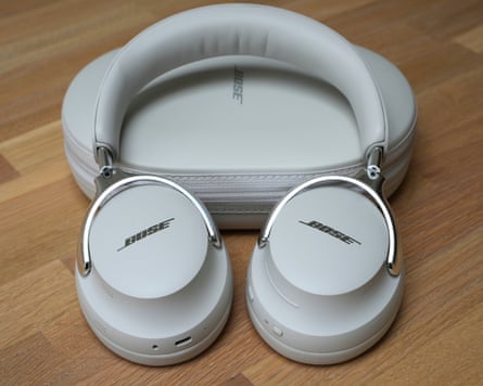 The Bose QuietComfort Ultra Headphones 2 laying on their closed case on a table.