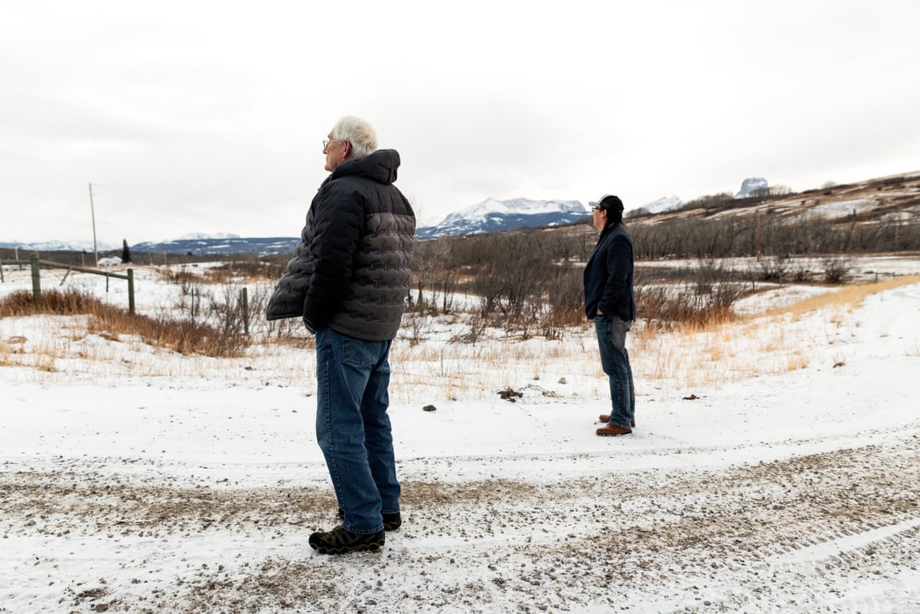 Buzz Cobell and Lauren Monroe survey the land on the Blackfeet reservation in Montana.