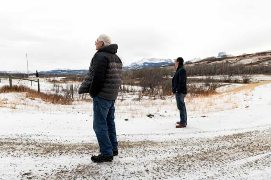 Buzz Cobell and Lauren Monroe take a moment to survey the land on the Blackfeet Reservation in Montana.