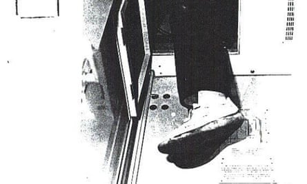 Frank Metzing’s leg poking out of his hiding place after being discovered on a train from Prague to Nuremberg in May 1983.