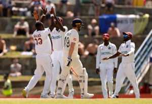 Woakes walks as Seales celebrates.