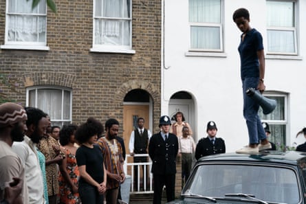 In an episode of Steve McQueen’s landmark series Small Axe, 2020. Wright is standing on the roof of a car holding a loud speaker