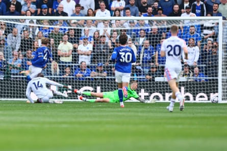 Jarrad Branthwaite falls on Jean-Philippe Mateta as Jordan Pickford dives and the ball hits a post