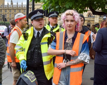 Police arresting a Just Stop Oil protester.