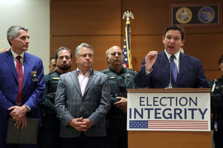 Ron DeSantis speaks from a lectern with a sign saying ‘Election Integrity’