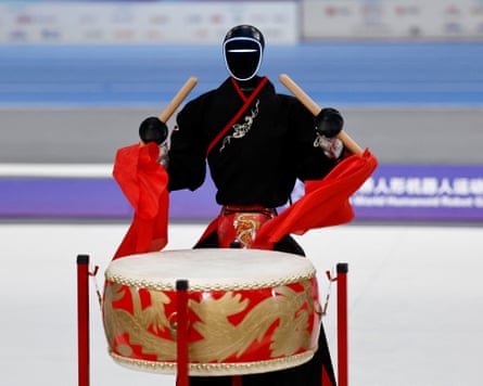 A humanoid robot built by the Chinese company Unitree Robotics plays a traditional drum