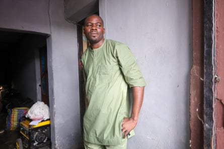 Daniel Ebiesua looking resigned in a flood-damaged room