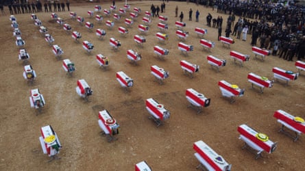 Coffins wrapped with the Iraqi flag