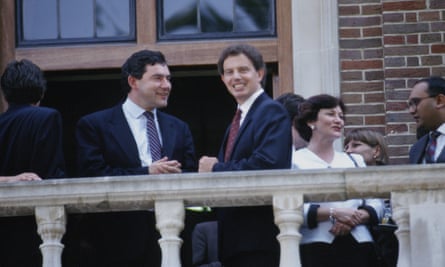 Young Tony Blair and Gordon Brown both in suits and smiling