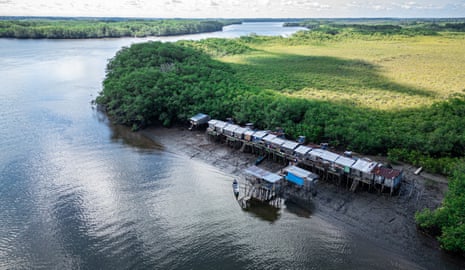 Aerial photo of an Afro-descendant community by a river in Ecuador