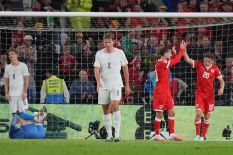 Wales' Daniel James (right) celebrates after he scores his side's equaliser.