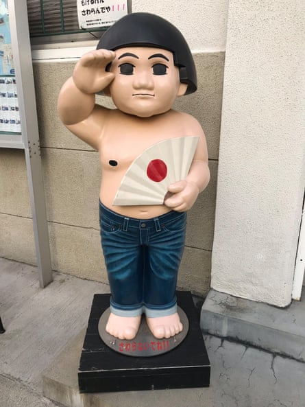 Figure of ‘Peach Boy’ outside the Momotaro Jeans Shop