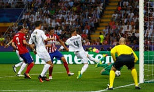 Ramos beats Oblak to the ball and scores from close range.