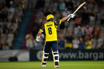 Liam Dawson raises his bat after hitting 50 for Hampshire against Surrey.