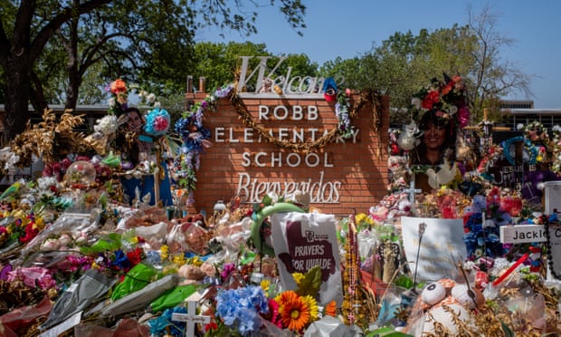 Flowers and tributes left at Robb elementary school on 17 June in Uvalde, Texas.  