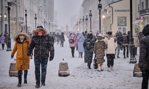 People in Moscow, Russia on 5 January. The snow flls heavily.