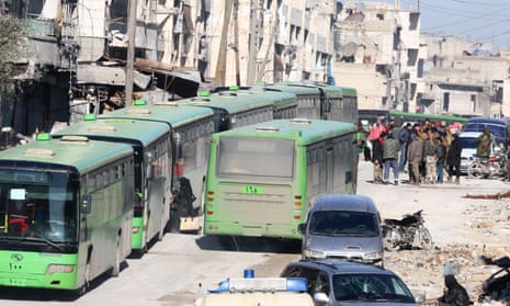 People board buses to be evacuated from east Aleppo.