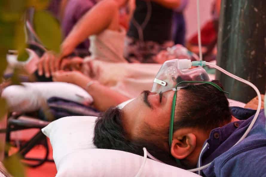 A Covid-19 coronavirus patient breathes with the help of oxygen provided by a Gurdwara, a place of worship for Sikhs on 6 May 2021.