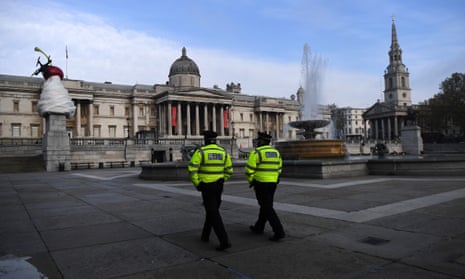 Police walk through London’s Trafalgar Square in early November during England’s second national lockdown.