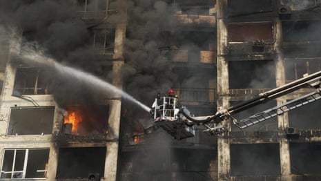 Ukraine: 15-storey residential building hit as attacks on Kyiv continue – video