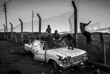 Children play on top of a car
