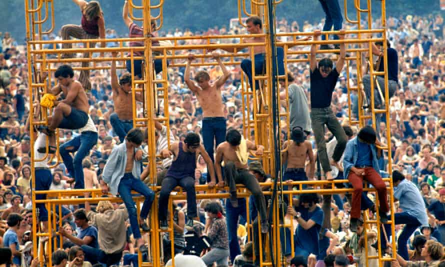 Tower of song … festivalgoers on a sound system at Woodstock.