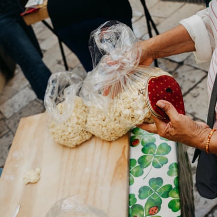 Bags of fresh orecchiette on a table