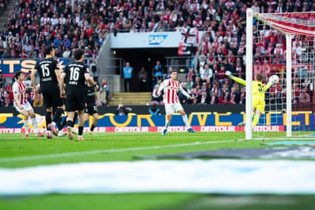 Eric Martel scores a precocious equaliser for Köln minutes earlier being sent off.