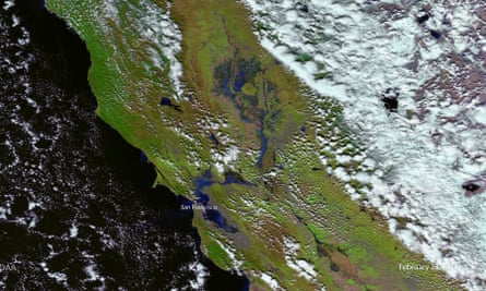 Nasa satellite imagery taken on 22 February shows how recent rains have swollen California’s lakes and rivers downslope of the Sierra mountains.