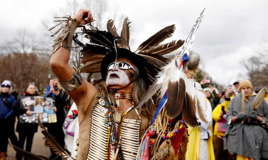 Little Thunder, a traditional dancer and indigenous activist from the Lakota tribe, dances as he demonstrates in front of the White House.