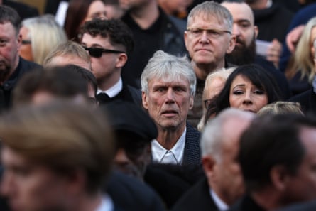 Bez in a crowd of people at the funeral
