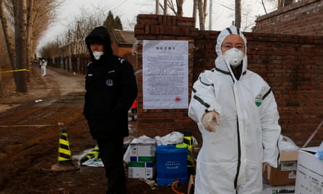 A Chinese Epidemic Prevention Officer investigates a site blocked due to African swine fever in the Beijing district of Tongzhou, China.