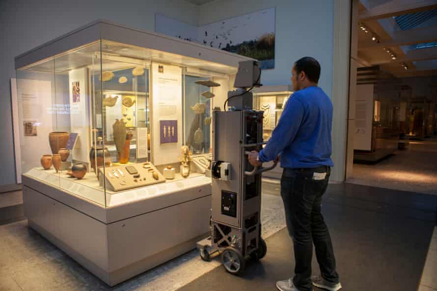 A Google employee photographs exhibits at the British Museum.