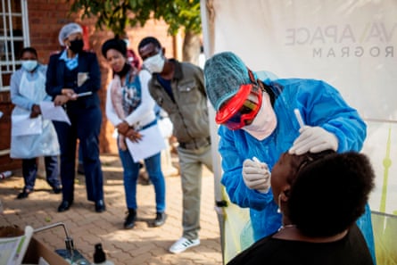 Nurse performs a swab test for Covid-19 on a health worker at the Vlakfontein Clinic in Lenasia, Johannesburg.