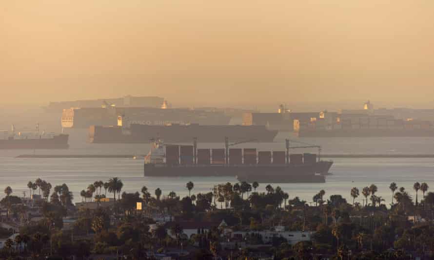 Container ships sit in the ocean waiting to unload their cargo at the ports of Los Angels and Long Beach on 22 September. 