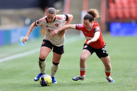 Liverpool's Cornelia Kapocs and Charlton's Mary McAteer battle for the ball during the FA Cup quarter-final.
