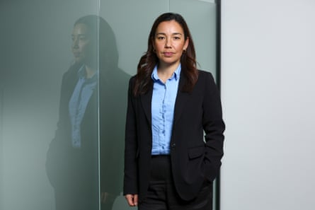 Qiulae Wong, the Opportunity party leader, stands next to a frosted glass room divider.