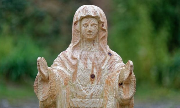 A detail of the redwood sculpture of Mary