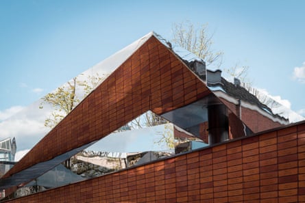 The National Holocaust Memorial of Names in Amsterdam honors the Jewish victims of the Holocaust with a labyrinth of broken mirrors displaying the names.
