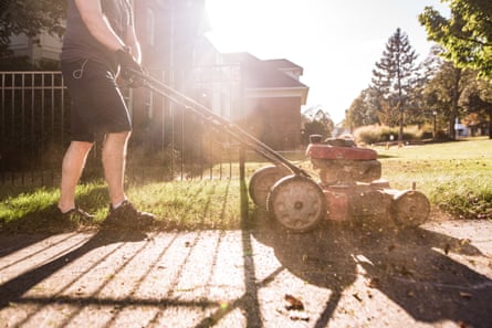 A man mowing a lawn