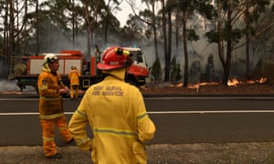 Rural Fire Service volunteers contain a bushfire south of Ulladulla, New South Wales