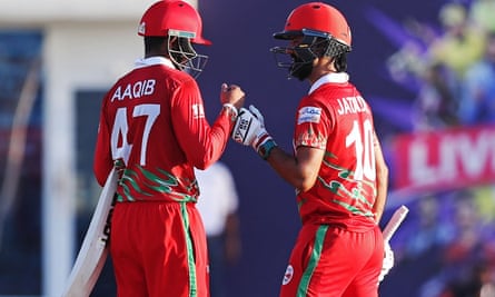 Oman’s Aqib Ilyas and Jatinder Singh celebrate after chasing down Papua New Guinea’s total without losing a wicket