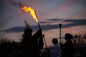The winter king holds a flaming sword as he celebrates Samhain.