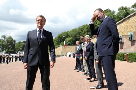 Emmanuel Macron and Édouard Philippe at a second world war memorial on 18 June