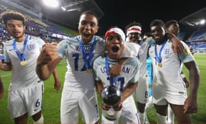 Ademola Lookman celebrates with the trophy and England teammates after winning the Under-20 World Cup in 2017.