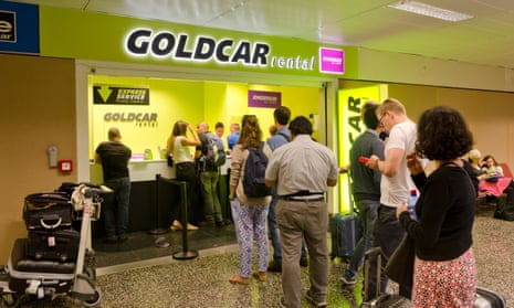 Customers queueing at Goldcar kiosk at Milan airport
