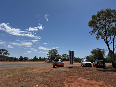 Police cars on desert road