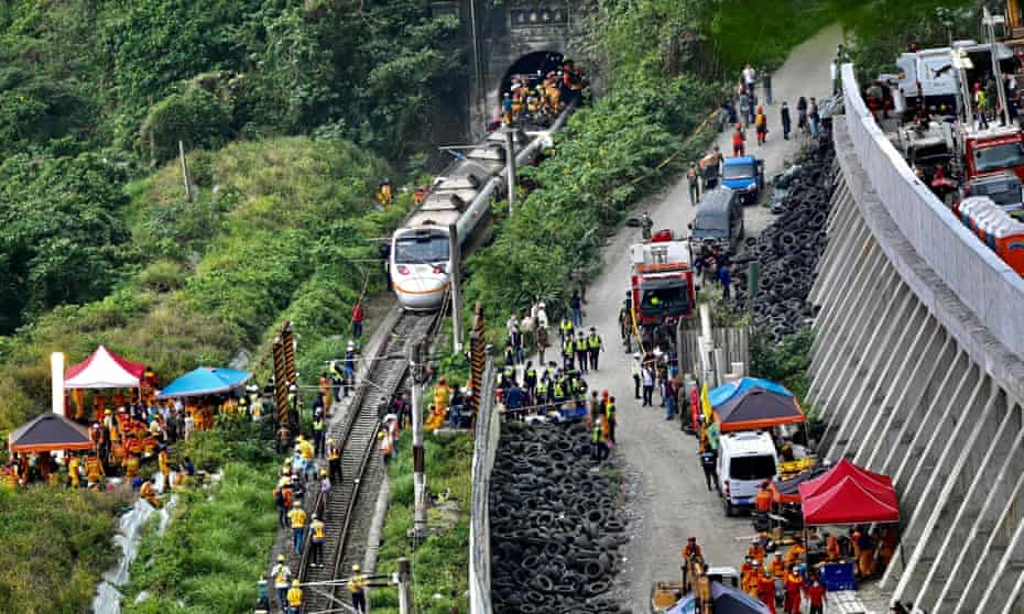 Rescue workers at the scene of the train derailment in the mountains of Hualien, eastern Taiwan